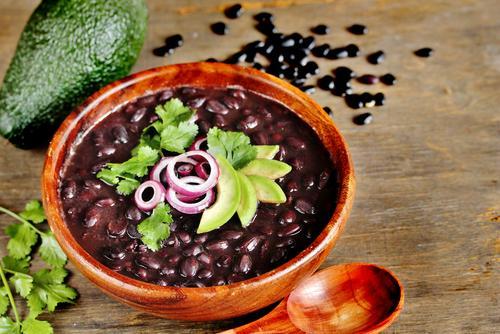 black bean soup in a bowl and avocado