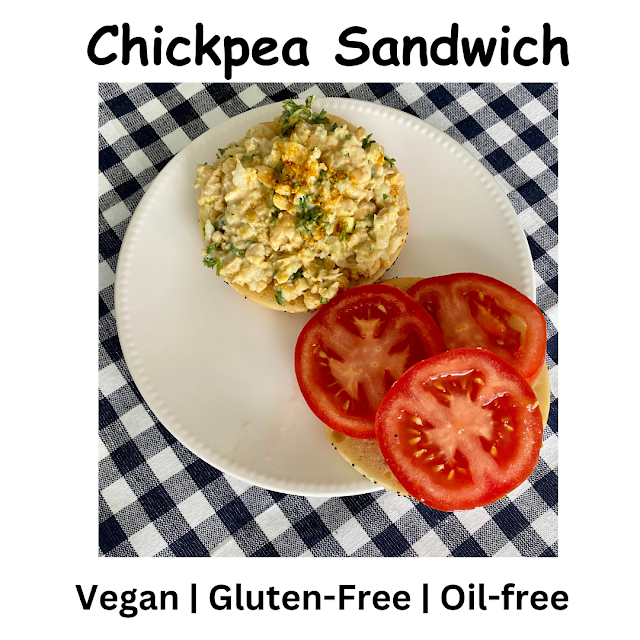 mashed chickpea sandwich with sliced tomato