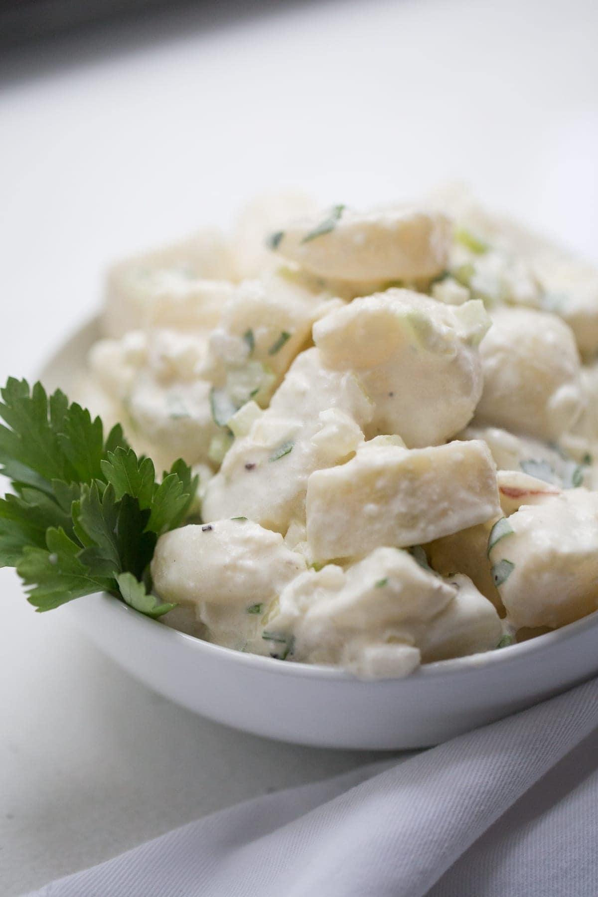 Potato salad in a white bowl