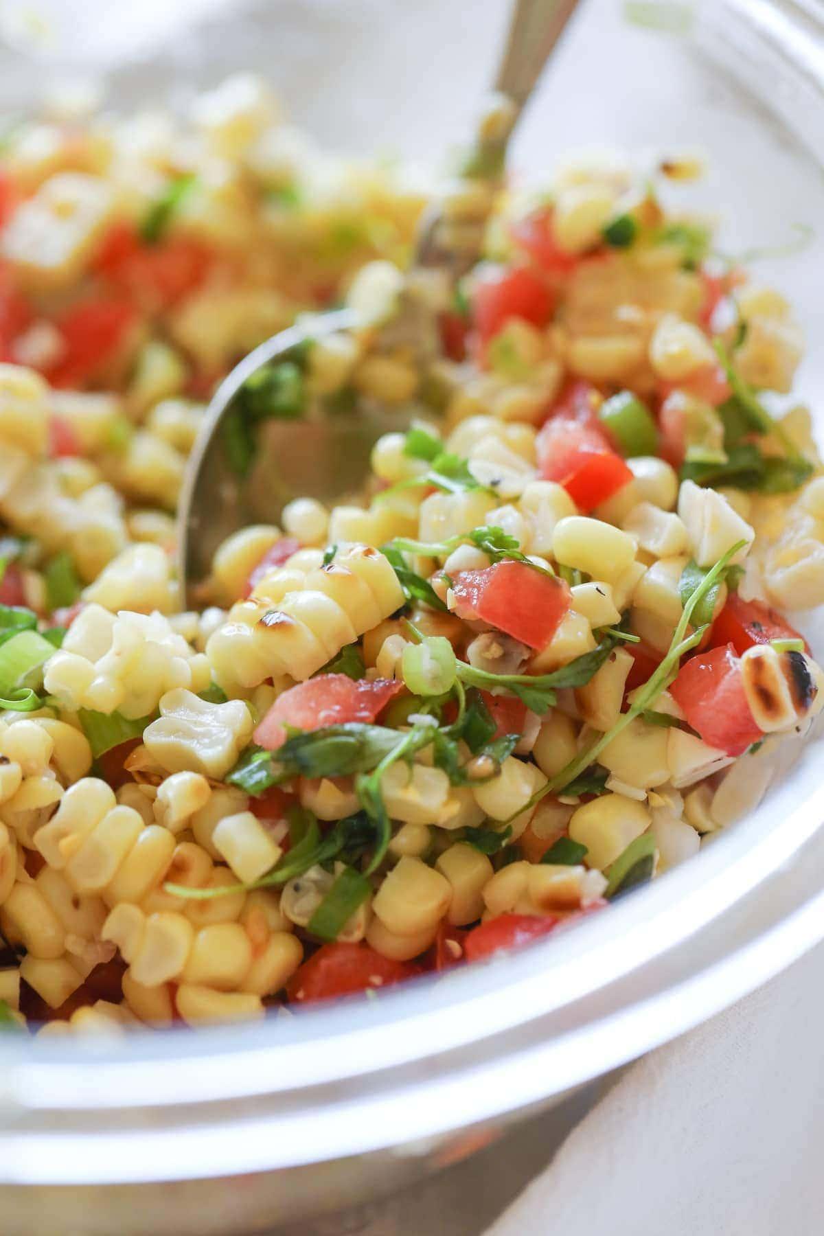 corn salsa in bowl with spoon
