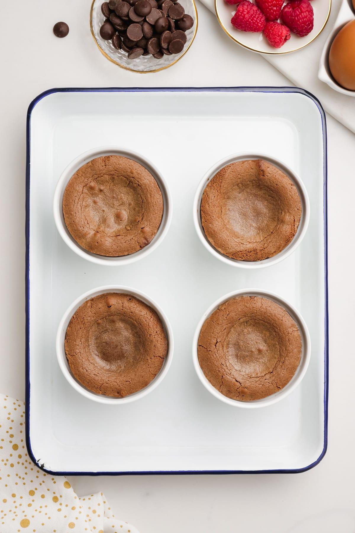 molten lava cake 11 baked molten-lava-cakes in ramekins on baking sheet