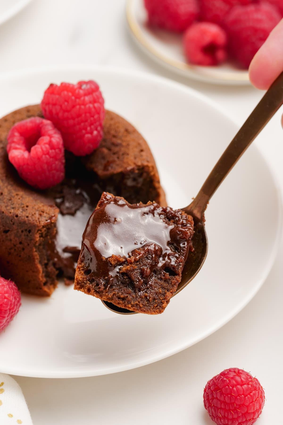 molten lava cake 19 molten-lava-cake with raspberries on plates with spooned out filling
