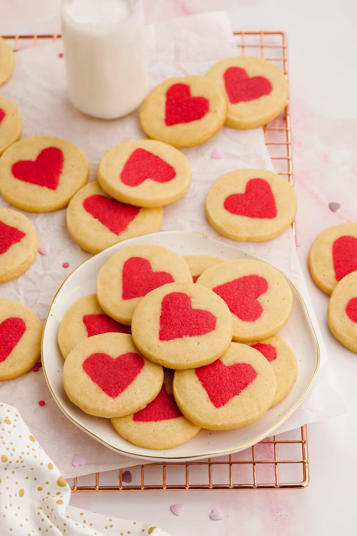 valentines day cookies 22 valentine's cookies loaded on a plate