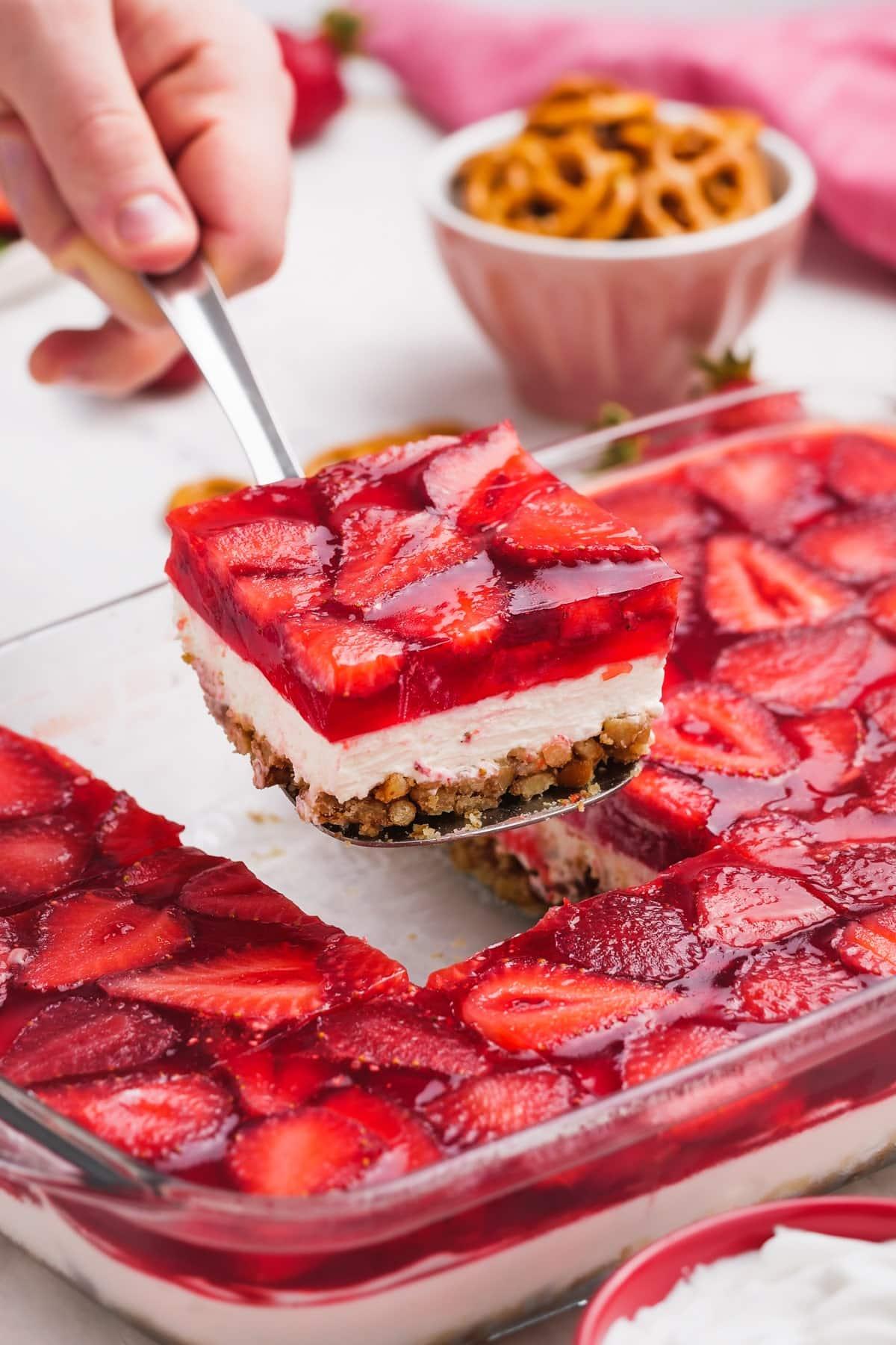 strawberry pretzel salad slice on a spatula
