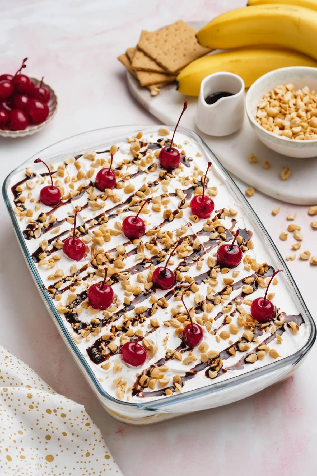 whole banana split cake decorated in cake pan