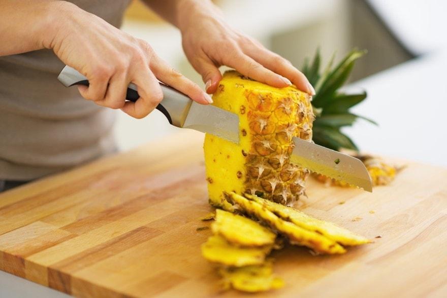 cutting a pineapple
