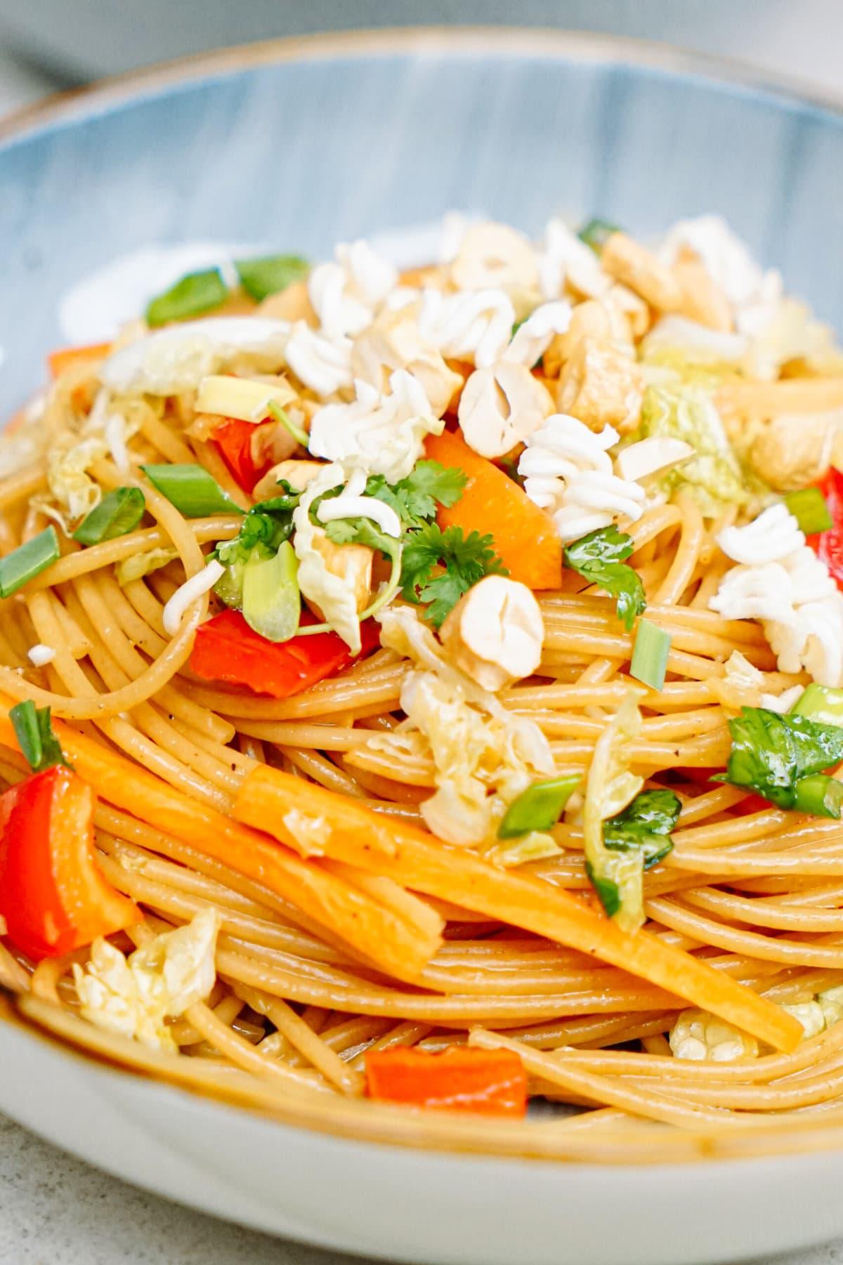 close up of sesame noodle salad in a bowl
