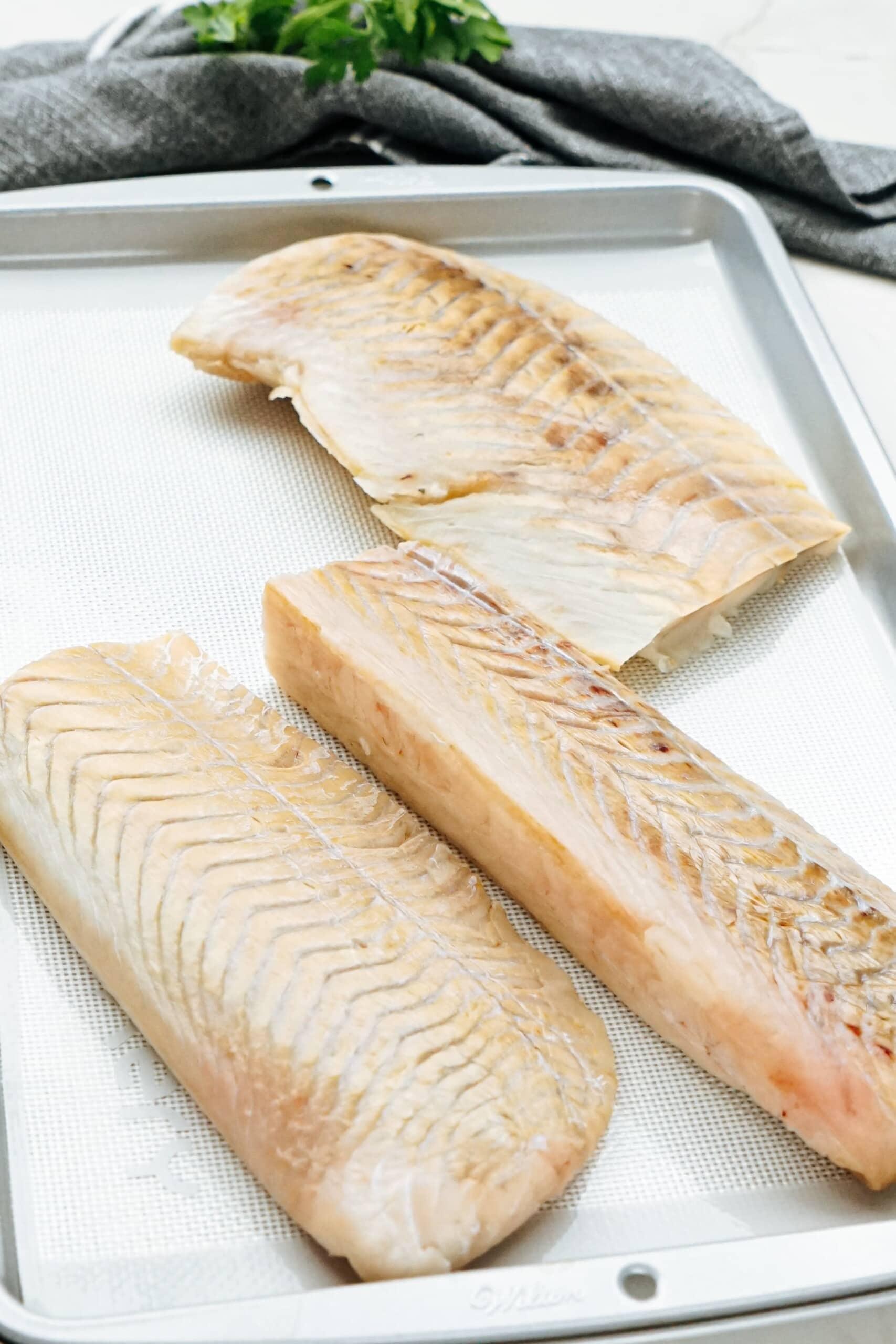 cod filets on a baking sheet