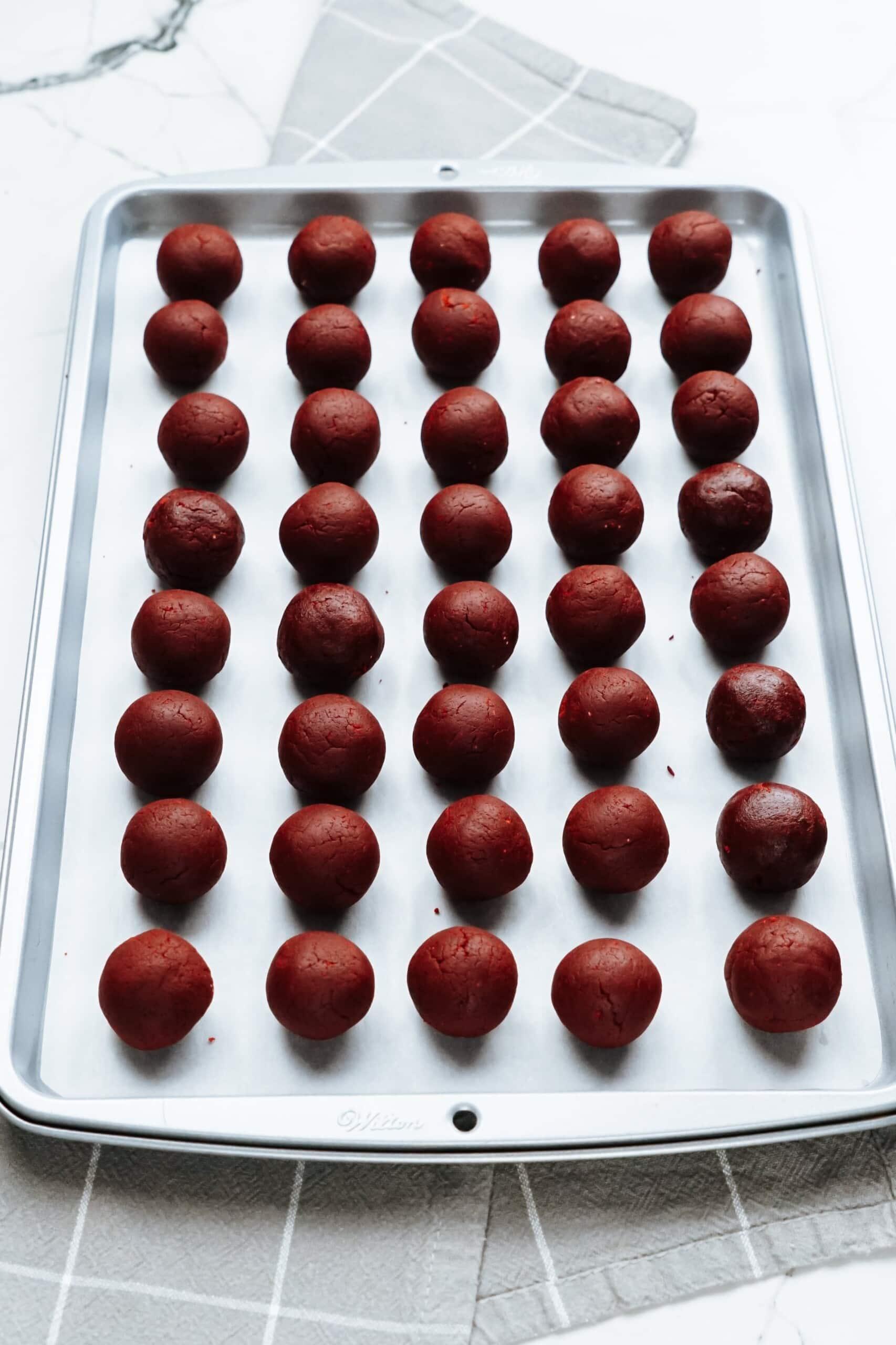 baking sheet full of cake balls