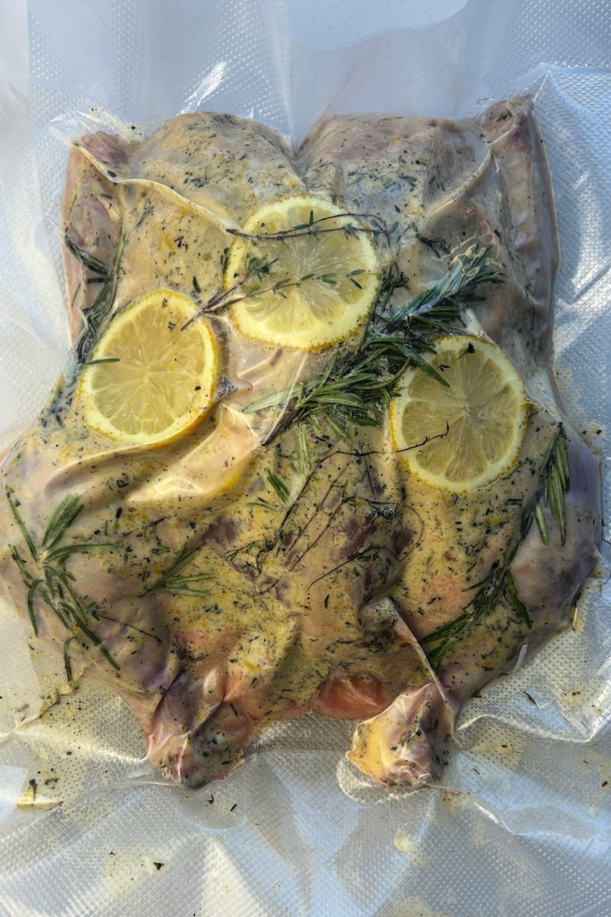 raw sous vide spatchcock chicken vacuumed sealed in bag