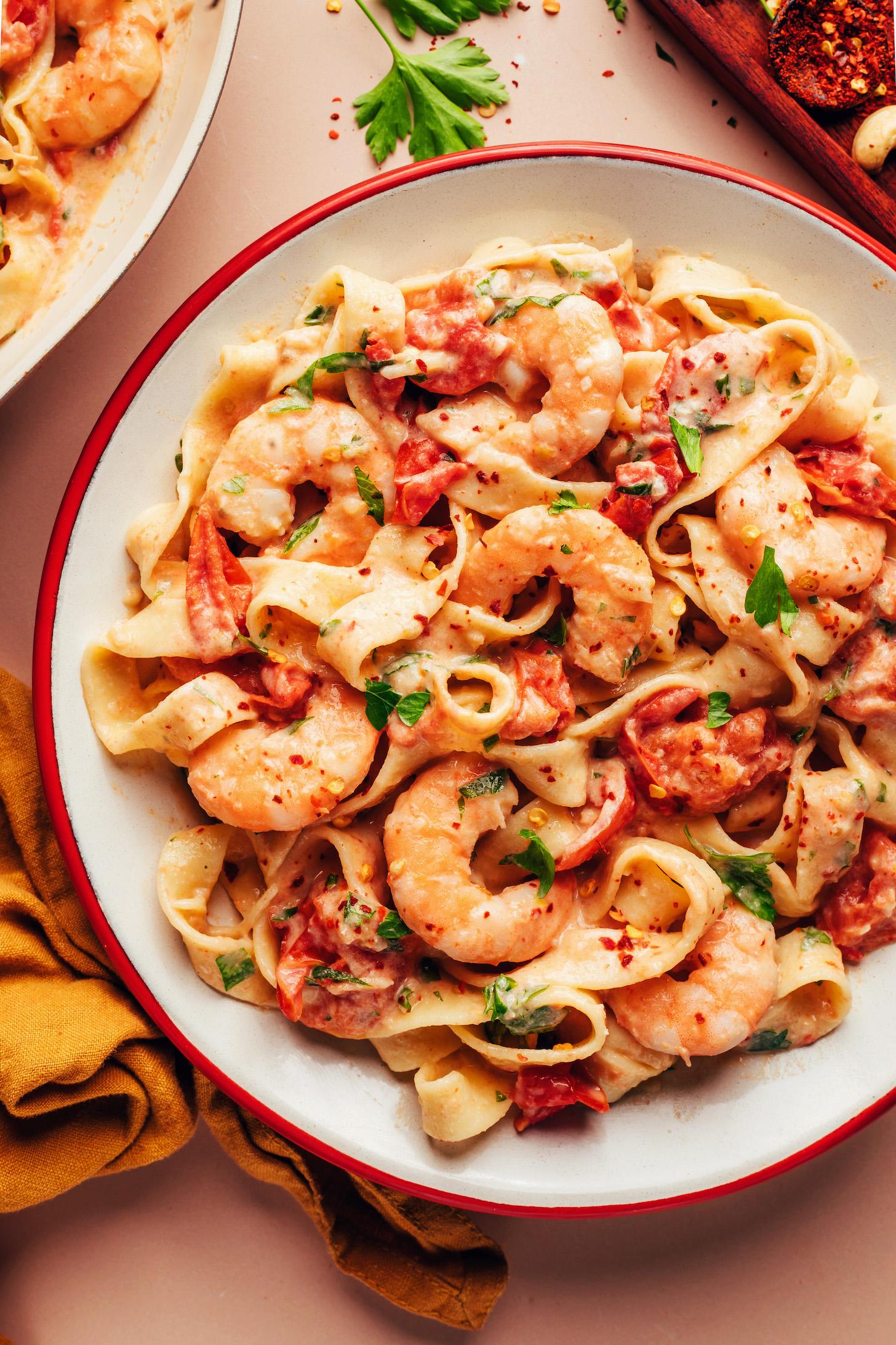 Large serving dish of our creamy dairy-free Tuscan shrimp pasta
