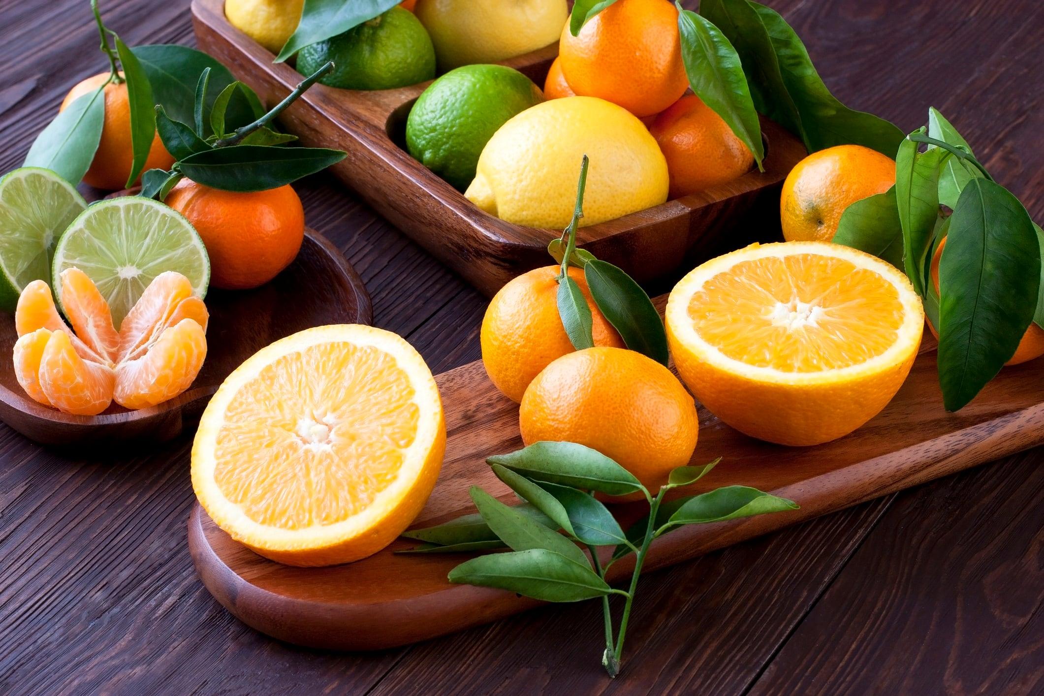 Citrus fruits on wooden background