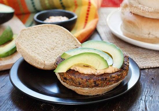 One bite of this spicy black bean burger with spicy chipotle mayo and creamy avocado and you won't miss the meat! Yes, these were good enough to please even the adult carnivore's in my home (a bit too spicy for my kids).
