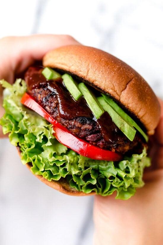 This is a veggie burger that even hearty meat-eaters will love! Made with beans, oats, brown rice, beets and a whole lot of spices, this veggie burger is a real crowd pleaser.