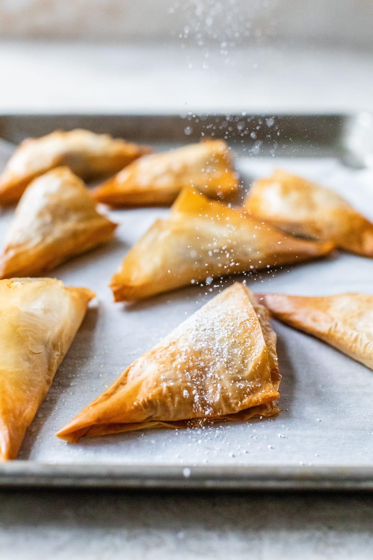 Apple Turnovers with powdered sugar.